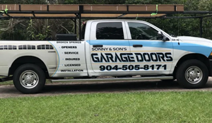 White service truck for Sonny & Sons Garage Doors.