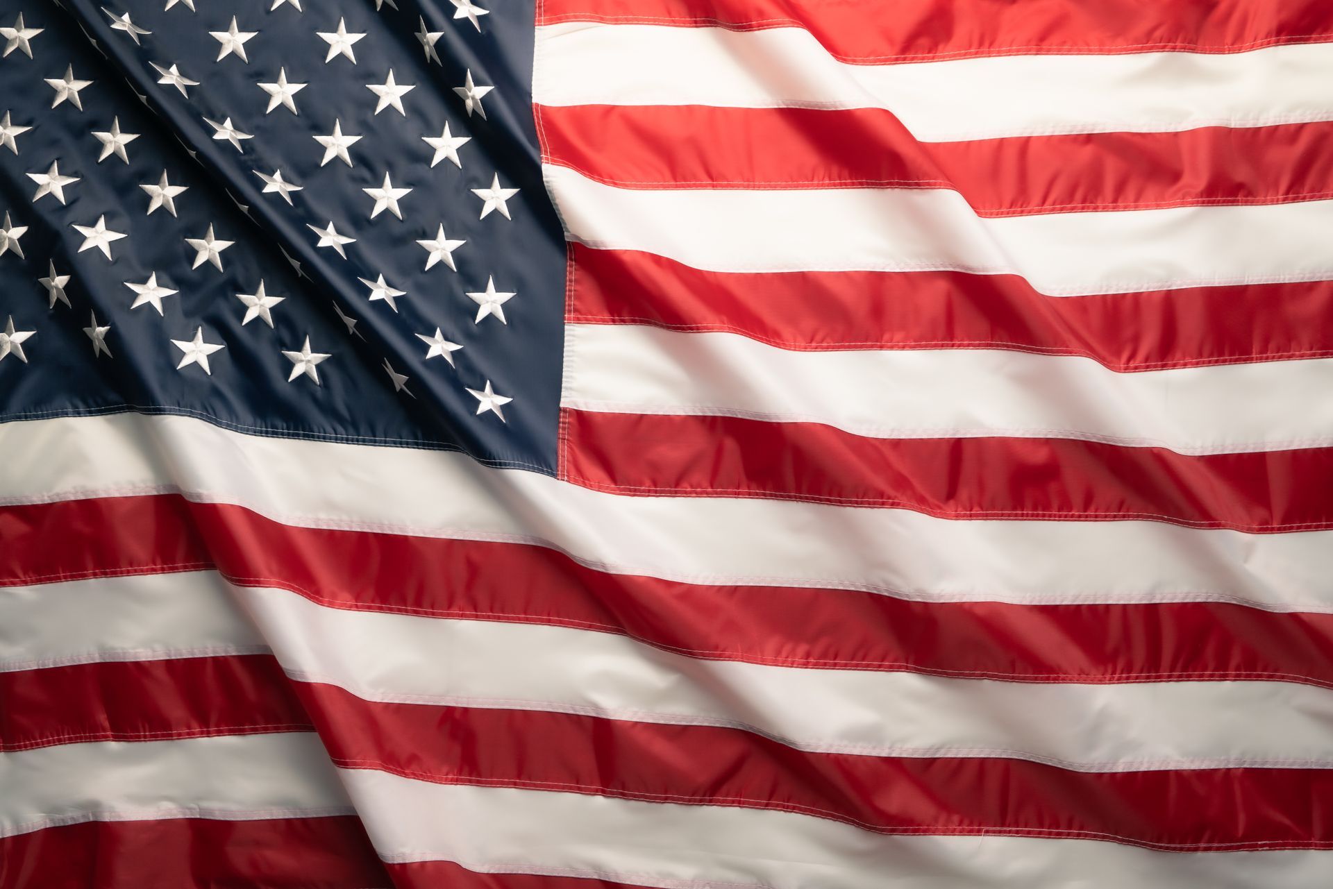 Waving American flag with stars and red-and-white stripes