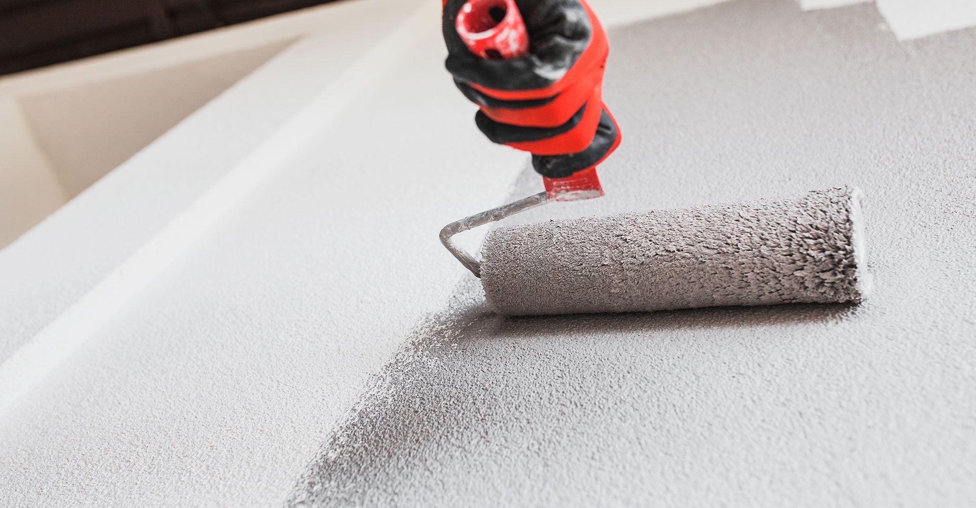 Painting the Wall with Gray Paint