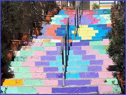 Colorful, painted outdoor staircase with geometric patterns.