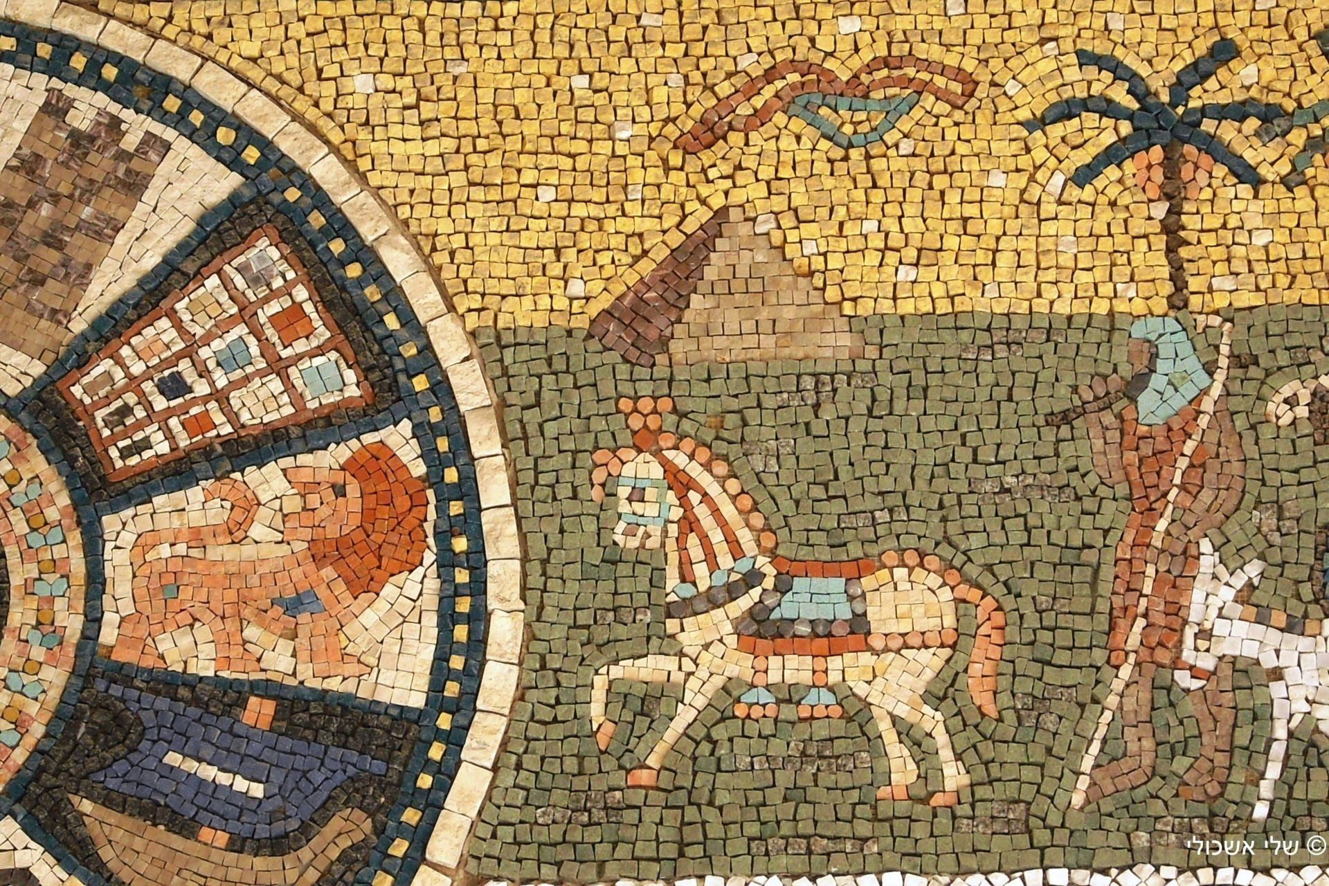 Mosaic: horse, pyramid, palm tree, and part of a zodiac wheel with a lion; earthy tones.