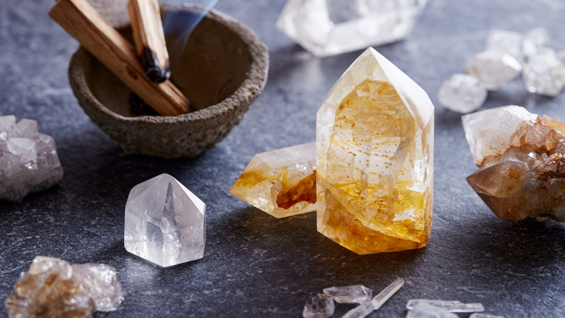 There are many different types of crystals on the table.