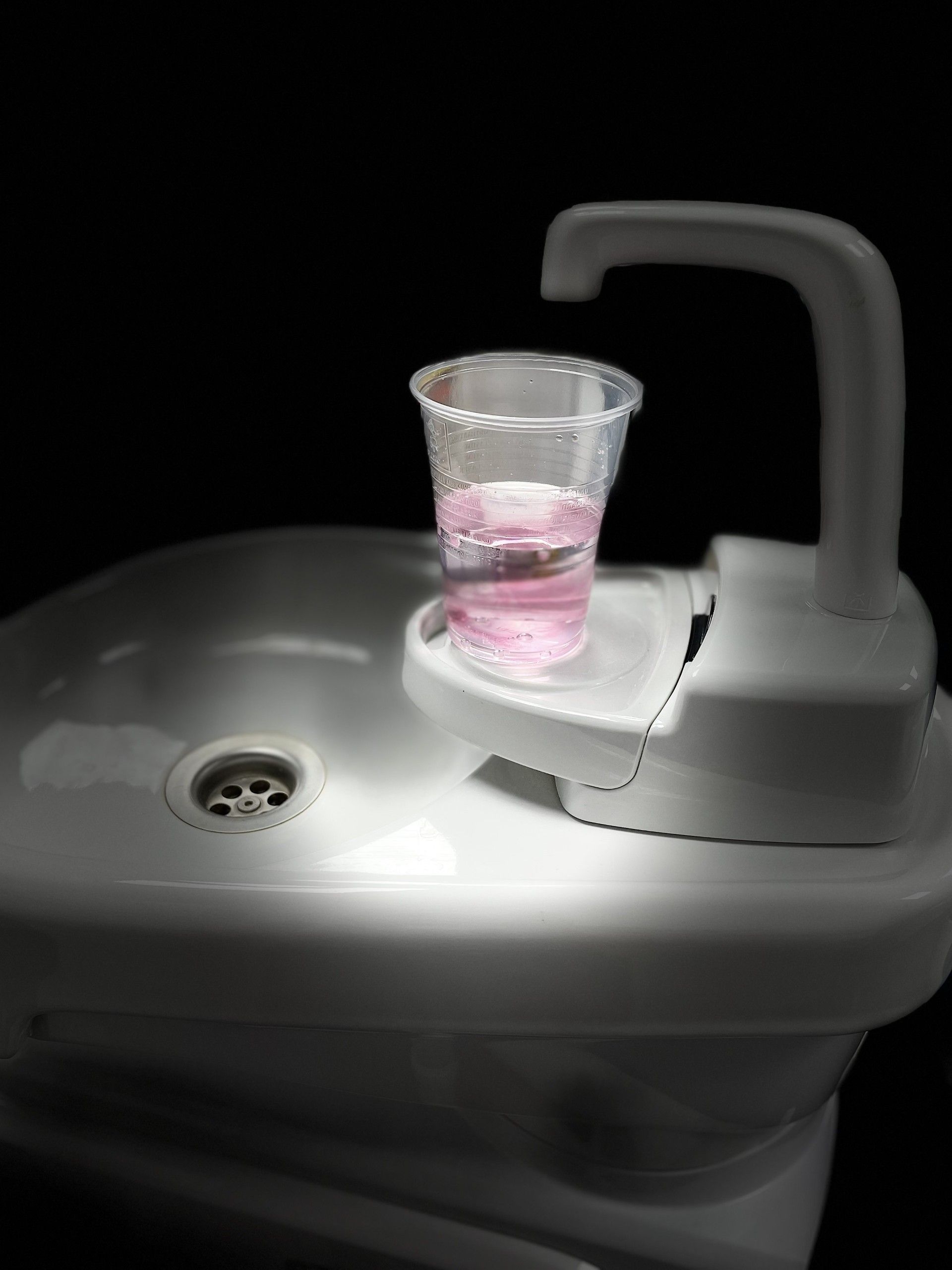 A dental cup of mouthwash, in a dental surgery.