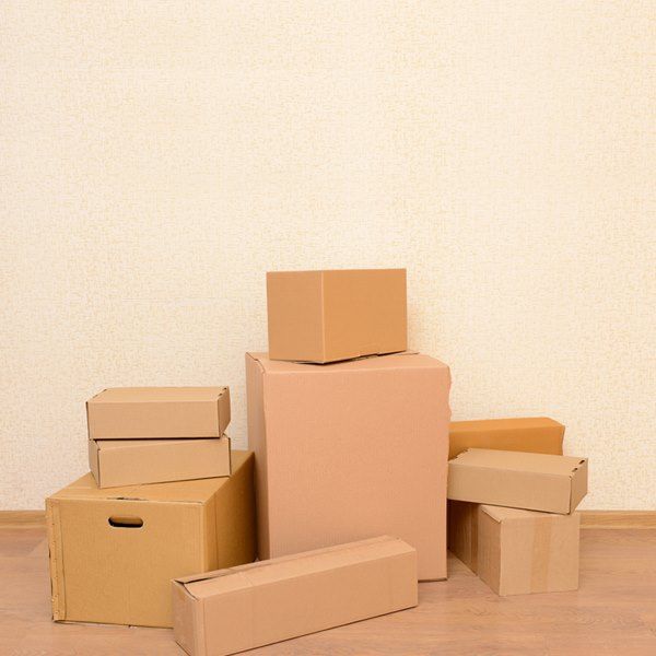 A Bunch of Cardboard Boxes Are Stacked on Top of Each Other — Bondi Removals and Taxi Trucks in Randwick, NSW