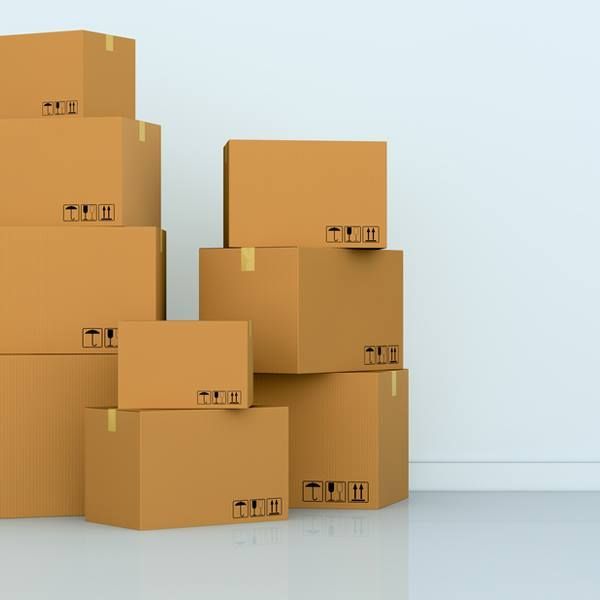 Several Cardboard Boxes Are Stacked on Top of Each Other — Bondi Removals and Taxi Trucks in Randwick, NSW