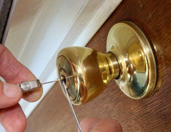 Locksmith unlocking a door.