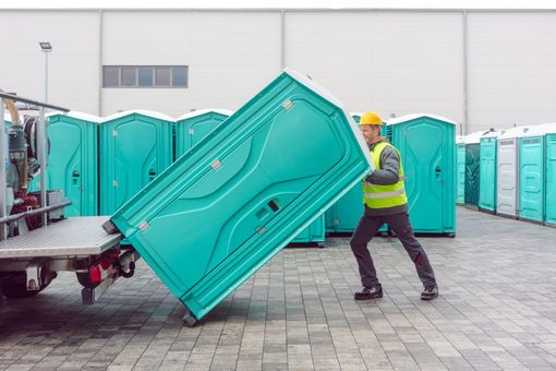 Man Lifting Portable Toilet - Memphis, RN - Arrow Portable Toilets Man Lifting Portable Toilet - Memphis, RN - Arrow Portable Toilets