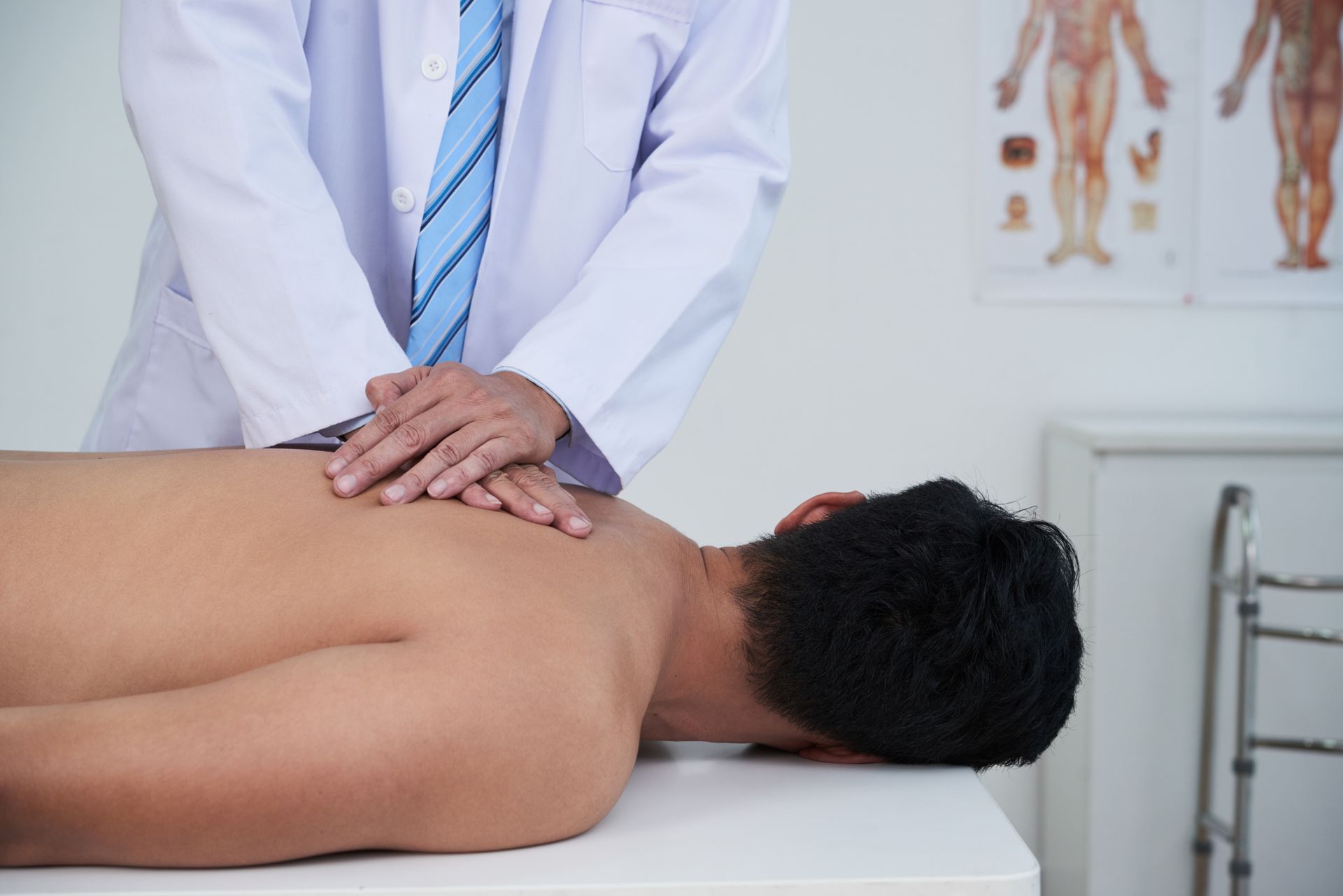 a man is giving a woman a neck massage .