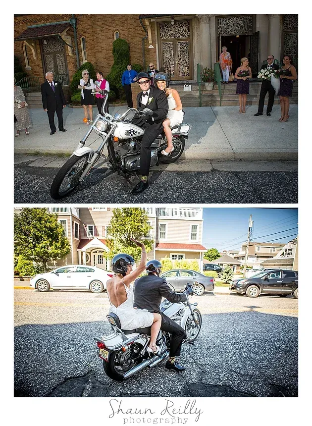Motorcycle decorated for a wedding with a bride and groom posing on it in front of a house