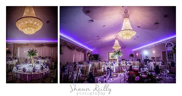 Elegant banquet hall with chandeliers, purple uplighting, and round tables set for an event