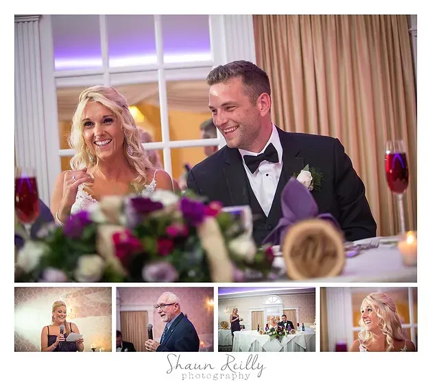 Bride and groom smiling at wedding reception with floral centerpiece and purple decor