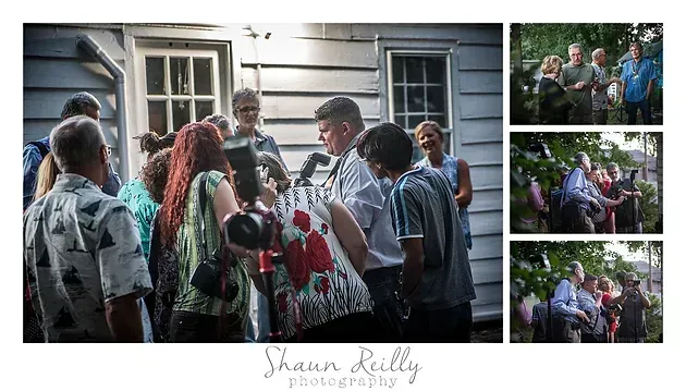 Guests chatting outside a house, with a flower-covered gift and small event photos on the right.