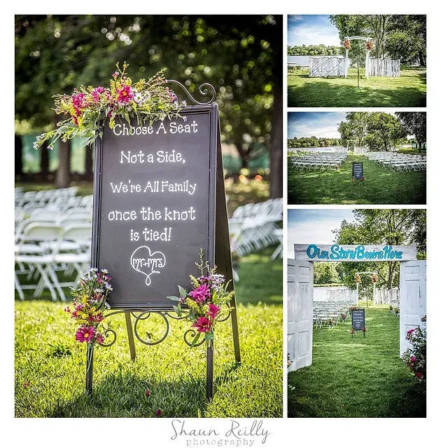 Wedding sign on a chalkboard easel with floral accents, reading “Choose a seat, not a side.”