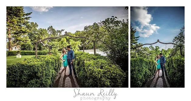 Couple walking on a garden path under an arbor of greenery and flowers