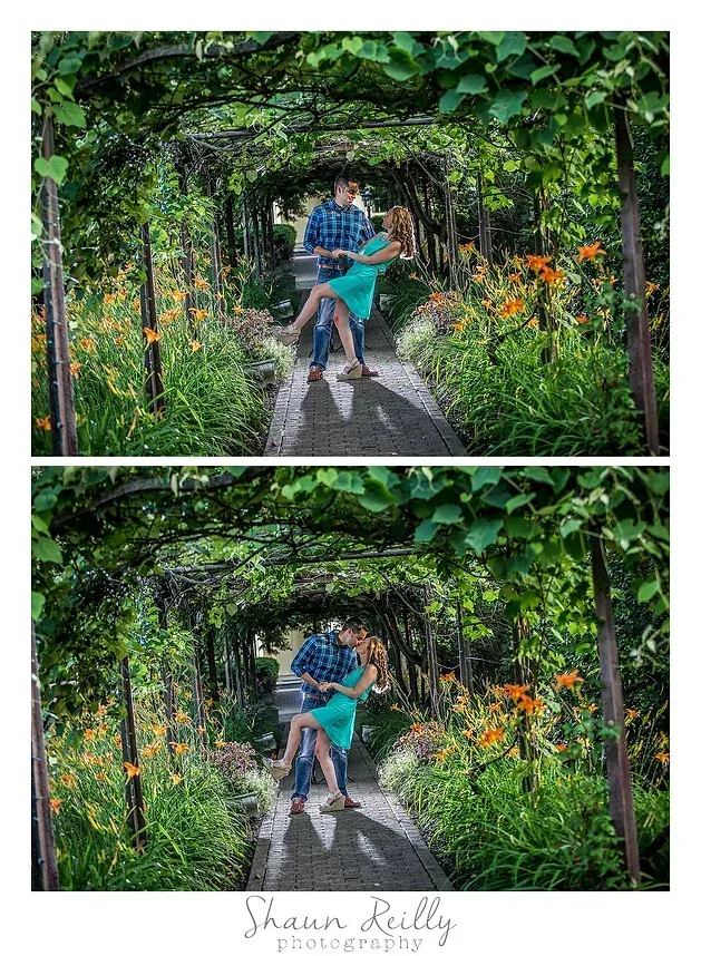 Person in a blue shirt and pink shorts on a bench under a leafy garden archway, with orange flowers nearby