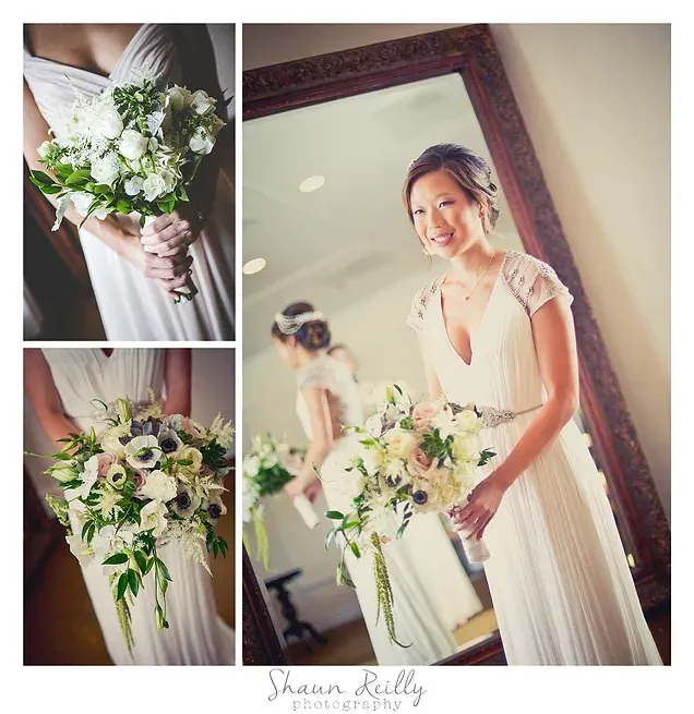 Bridal bouquet and smiling bride in white dress holding flowers in a bright room