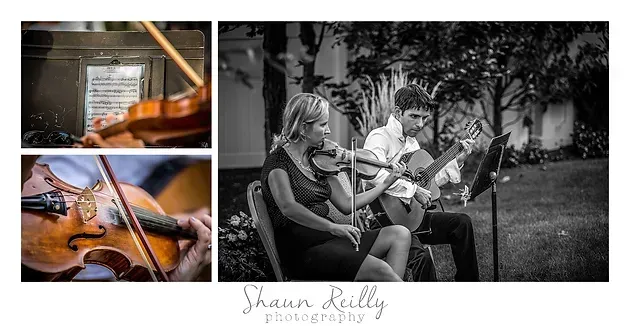 Violinist playing outdoors with seated guitarist and string players in a black-and-white performance scene