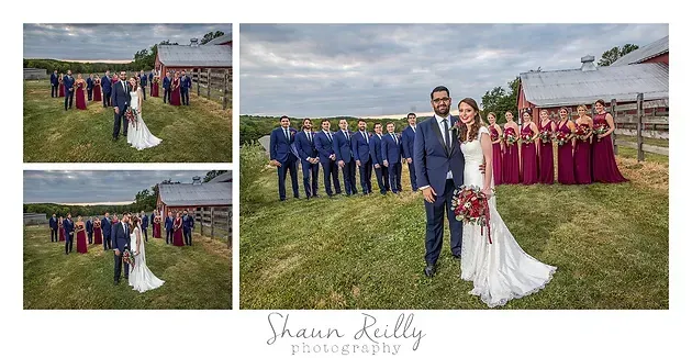 Wedding party posing outdoors on a grassy field with bride and groom center, bridesmaids in burgundy, groomsmen in blue