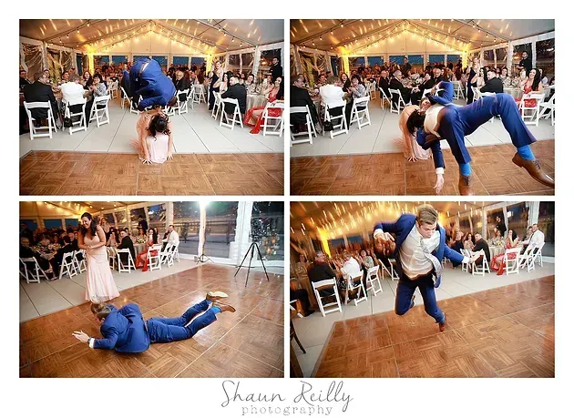 Wedding reception dance with a couple in blue suit and white dress doing playful lifts and dips on the floor