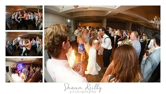 Wedding reception dance floor with guests gathered under warm indoor lighting