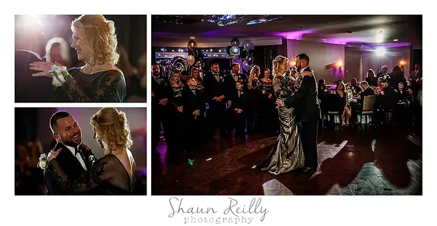 Wedding couple dancing in a purple-lit reception hall while guests watch and applaud.