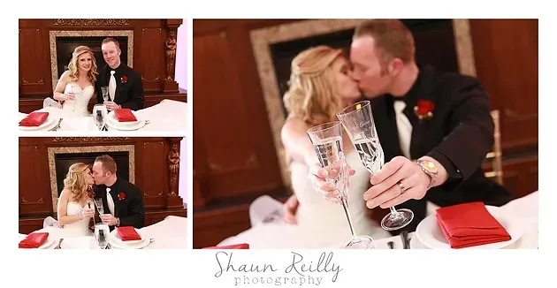 Wedding couple signing documents, then sharing a kiss at a wooden table with flowers and a red pouch.