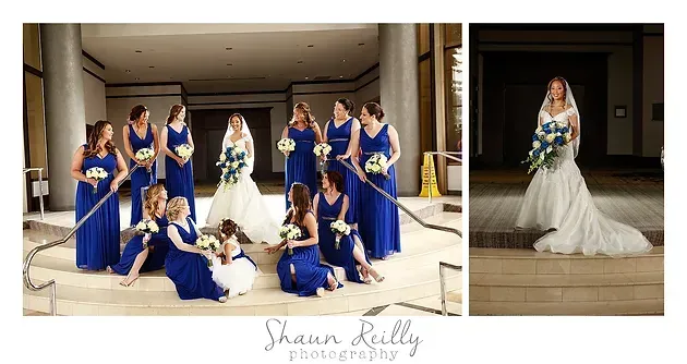 Wedding party poses with bride in white gown and bridesmaids in royal blue dresses