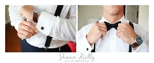 Man in white dress shirt adjusting black bow tie and silver cufflinks.
