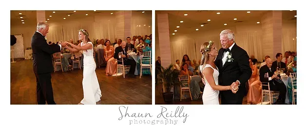 Bride and groom dancing at a wedding reception, with guests watching in a warmly lit ballroom