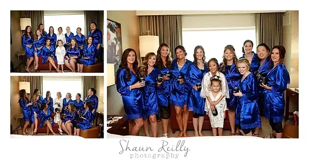 Formal group portrait of people in matching blue satin outfits in a hotel room