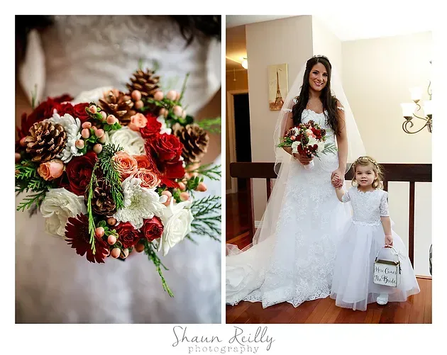 Bride holding red-and-white bouquet beside a flower girl in a white dress indoors