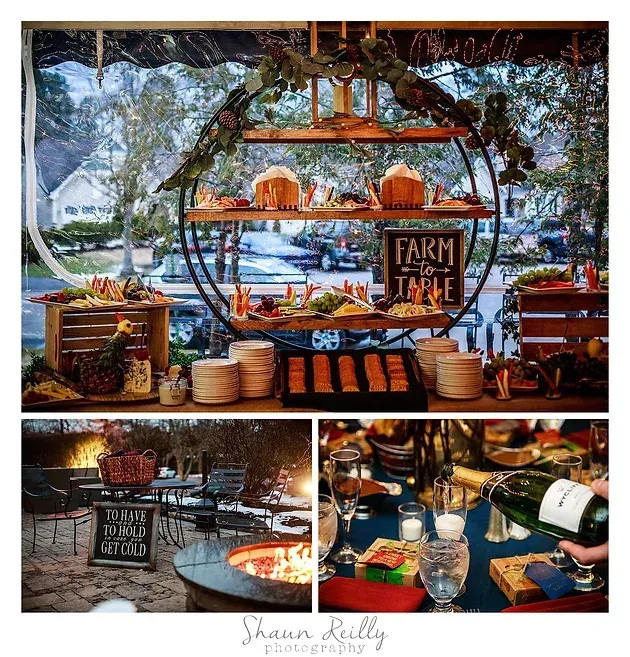 Rustic farm stand with baked goods, produce, and wine on a wooden display table outdoors