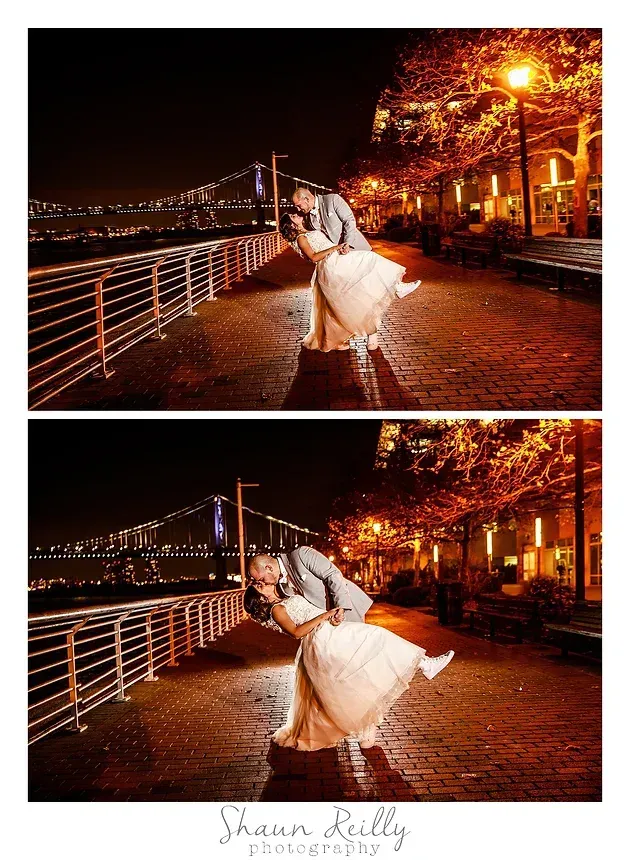 Couple dancing on a rain-slick waterfront walkway at night, lit by warm streetlights and reflections.