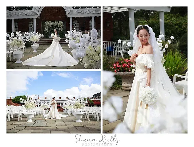 Bride in white gown posing outdoors in a garden wedding scene with floral decor and a long veil