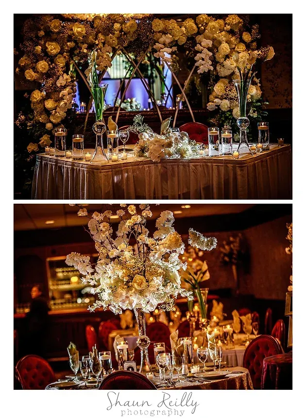 Elegant floral banquet tables with gold decor and candlelight in a warm indoor venue