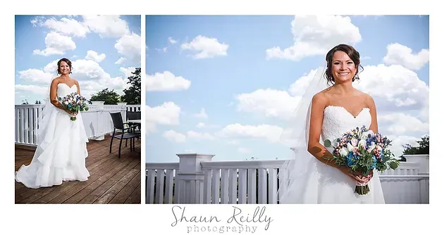 Bride in a white gown holding a bouquet on a rooftop under a blue sky