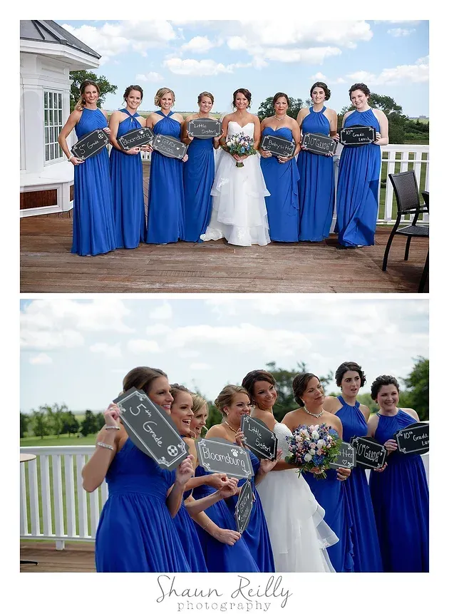 Bridesmaids in blue dresses pose with the bride outdoors on a wooden deck.