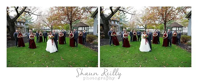 Wedding couple posing with guests in a park under autumn trees