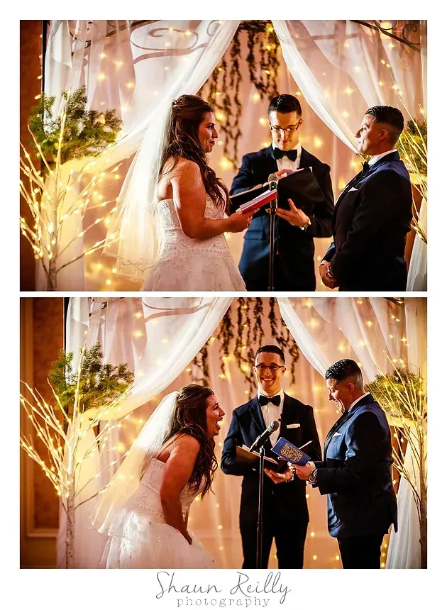 Wedding couple exchanging vows under draped lights with an officiant nearby and a guest watching