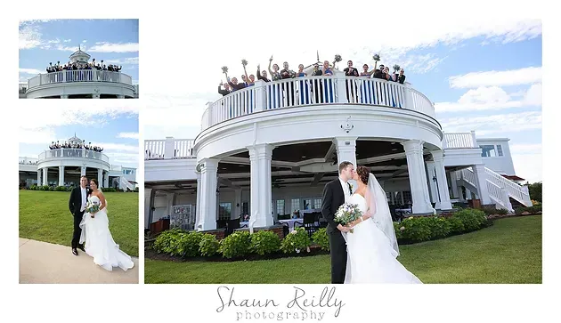 Bride and groom wedding portraits at a white mansion with guests on the balcony