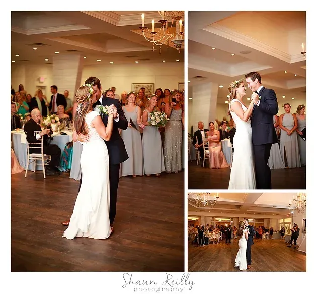 Bride and groom share a dance at a wedding reception while guests watch nearby.