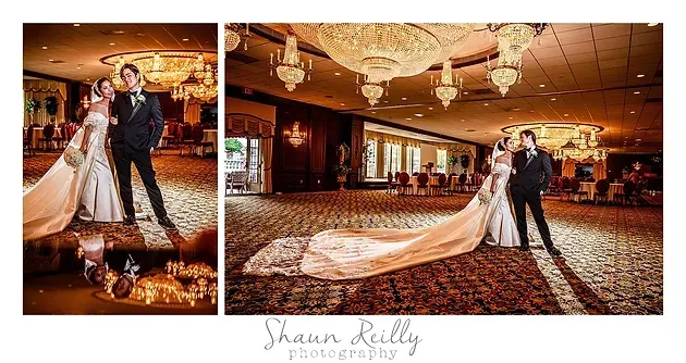 Wedding couple dancing in a warmly lit ballroom with patterned carpet and chandeliers