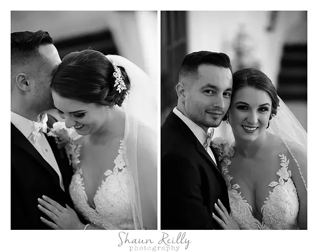 Black-and-white wedding portrait of a couple, close together and smiling, with the bride in a veil and lace dress.