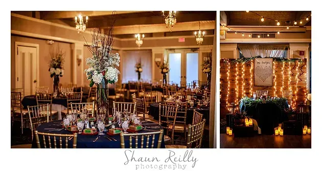Elegant wedding reception with candlelit tables, tall floral centerpiece, and twinkling lights on the stage