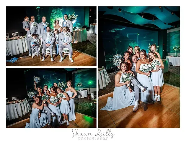 Group of people posing in matching formal outfits at an indoor event, holding bouquets and smiling