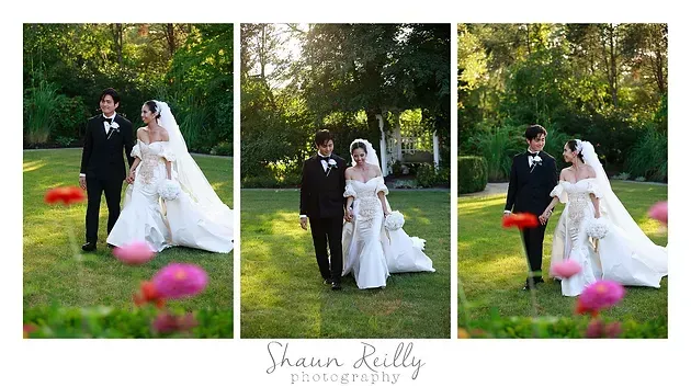 Wedding couple posing outdoors in a green garden, with white dress and black tuxedo, pink flowers in foreground