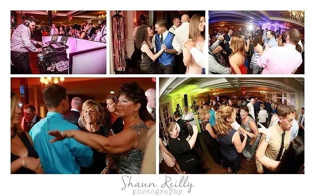 Guests dancing and chatting at a lively indoor reception with colorful lighting and decorated tables