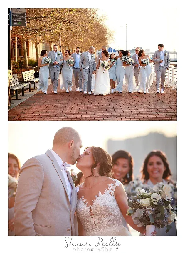 Wedding couple kissing outdoors with bridal party in light blue suits and white dresses behind them