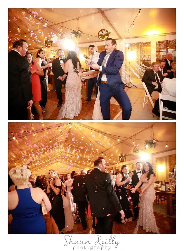 Wedding reception dance floor under string lights, with guests dancing and cheering in a warmly lit tent.