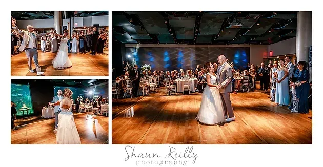 Couple dancing in a warmly lit reception hall with guests watching and a live band in the background